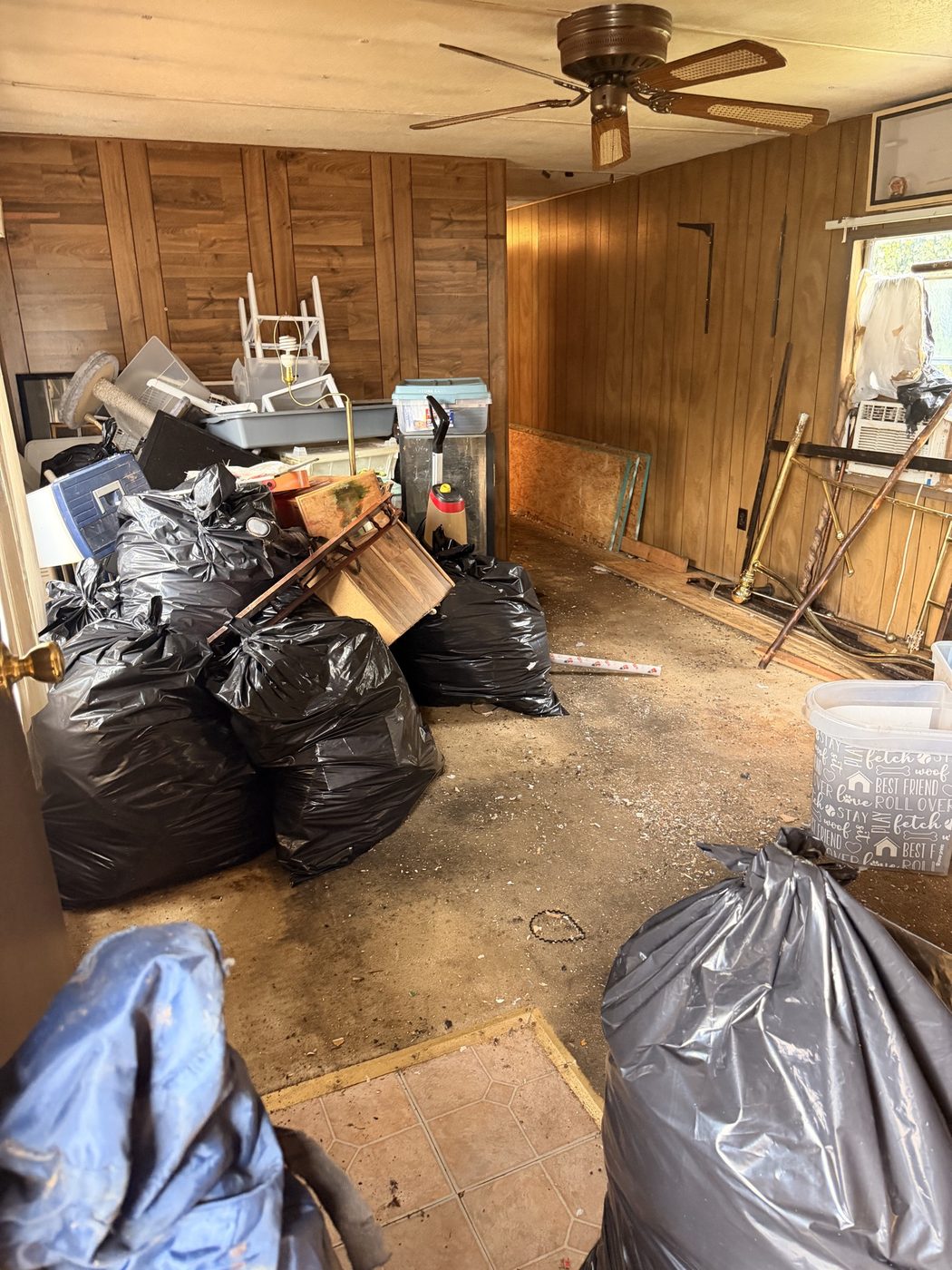 Bagged junk inside a room before pickup