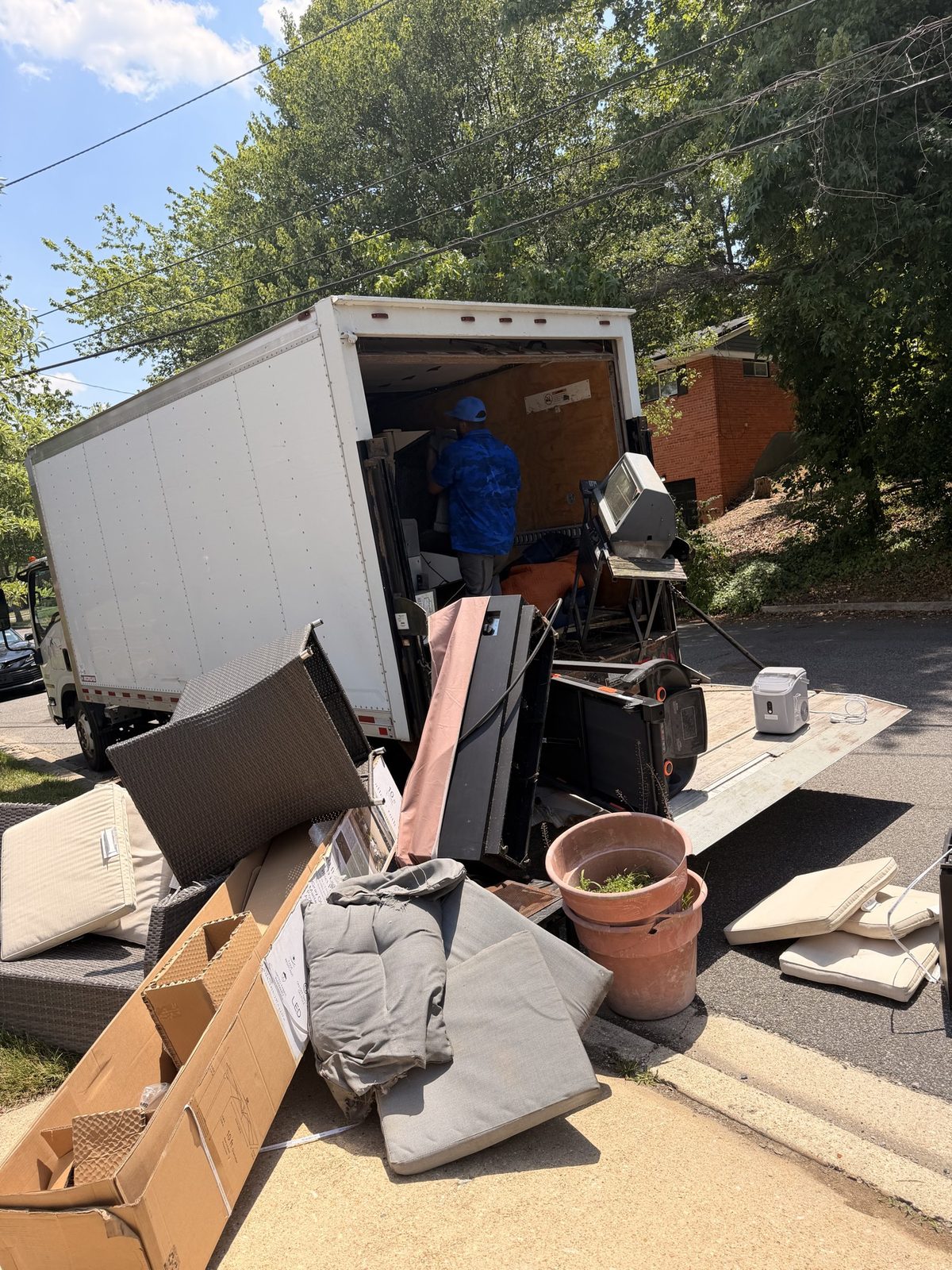 White box truck loaded with patio furniture